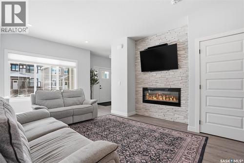 1047 Brighton Gate, Saskatoon, SK - Indoor Photo Showing Living Room With Fireplace