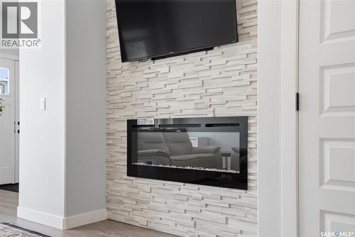 1047 Brighton Gate, Saskatoon, SK - Indoor Photo Showing Other Room With Fireplace