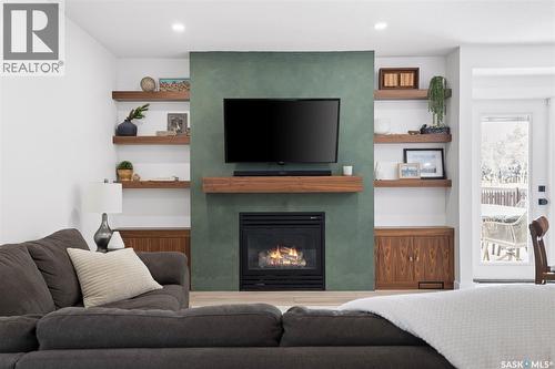 2002 Braun Bay E, Regina, SK - Indoor Photo Showing Living Room With Fireplace