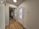 Entryway featuring light-toned flooring, a white entry door with decorative glass, and mirrored closet doors - 23 Arrowhead Crescent Unit# Upper, Kitchener, ON  - Indoor Photo Showing Other Room 