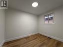 This room features light-toned walls, a window with white trim, and light wood-style flooring - 23 Arrowhead Crescent Unit# Upper, Kitchener, ON  - Indoor Photo Showing Other Room 