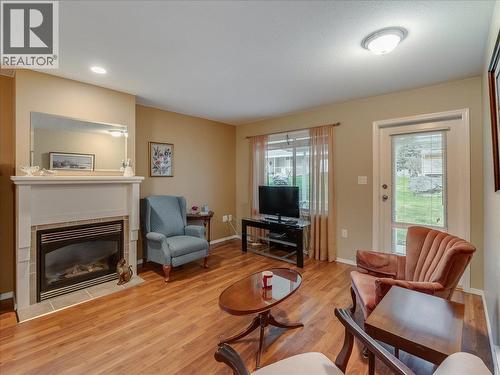 7136 Wright Way, Trail, BC - Indoor Photo Showing Living Room With Fireplace