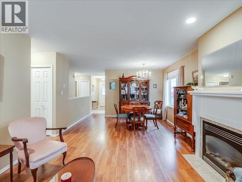 7136 Wright Way, Trail, BC - Indoor Photo Showing Living Room With Fireplace