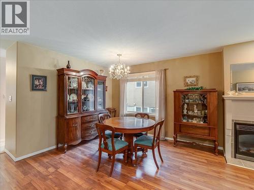 7136 Wright Way, Trail, BC - Indoor Photo Showing Dining Room With Fireplace