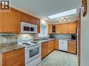 7136 Wright Way, Trail, BC  - Indoor Photo Showing Kitchen With Double Sink 