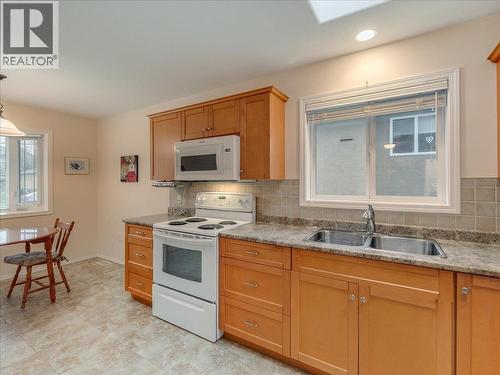 7136 Wright Way, Trail, BC - Indoor Photo Showing Kitchen With Double Sink