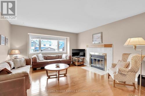73 Bramblegrove Crescent, Ottawa, ON - Indoor Photo Showing Living Room With Fireplace