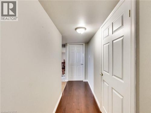 Hallway with baseboards and dark wood-style flooring - 9183 Silver Street, Caistor Centre, ON - Indoor Photo Showing Other Room