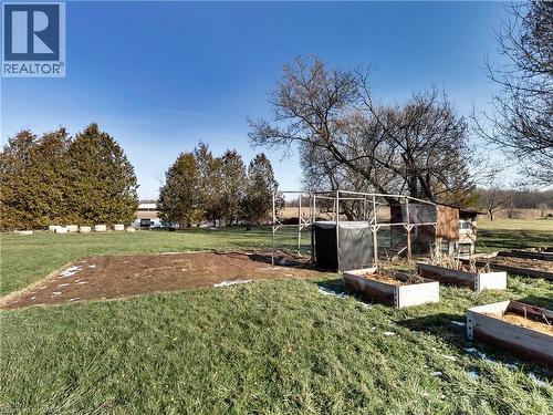 View of green lawn featuring a garden - 9183 Silver Street, Caistor Centre, ON - Outdoor