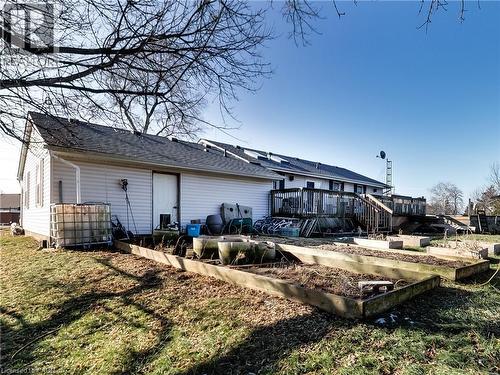 Back of house with a vegetable garden, a deck, and roof with shingles - 9183 Silver Street, Caistor Centre, ON - Outdoor