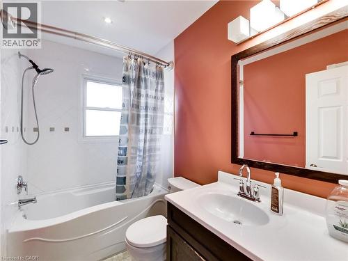 Full bathroom featuring a vanity with an integrated sink, framed mirror, and three-light fixture - 9183 Silver Street, Caistor Centre, ON - Indoor Photo Showing Bathroom