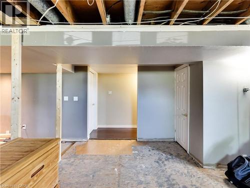 Unfinished basement space featuring exposed ceiling joists and support beams - 9183 Silver Street, Caistor Centre, ON - Indoor Photo Showing Other Room