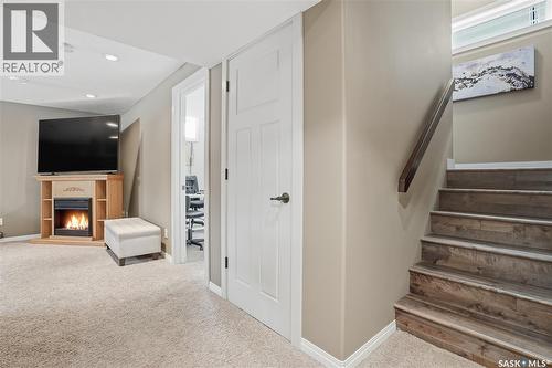 1532 Maple Hill Crescent N, Regina, SK - Indoor Photo Showing Other Room With Fireplace