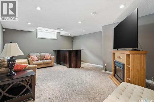 1532 Maple Hill Crescent N, Regina, SK - Indoor Photo Showing Other Room With Fireplace