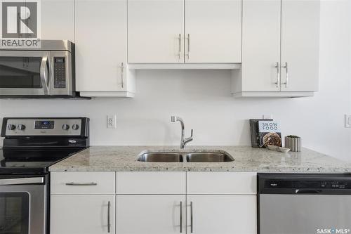 211 770 Childers Crescent, Saskatoon, SK - Indoor Photo Showing Kitchen With Double Sink