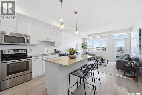 211 770 Childers Crescent, Saskatoon, SK - Indoor Photo Showing Kitchen With Stainless Steel Kitchen With Upgraded Kitchen