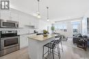 211 770 Childers Crescent, Saskatoon, SK  - Indoor Photo Showing Kitchen With Stainless Steel Kitchen With Upgraded Kitchen 