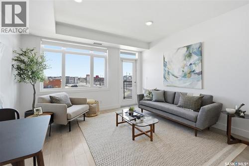 211 770 Childers Crescent, Saskatoon, SK - Indoor Photo Showing Living Room