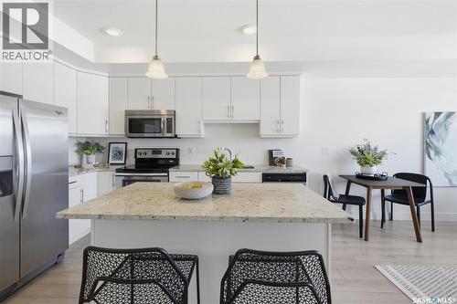 211 770 Childers Crescent, Saskatoon, SK - Indoor Photo Showing Kitchen With Stainless Steel Kitchen With Upgraded Kitchen