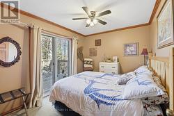 Main floor bedroom 2 with walkout onto deck - 