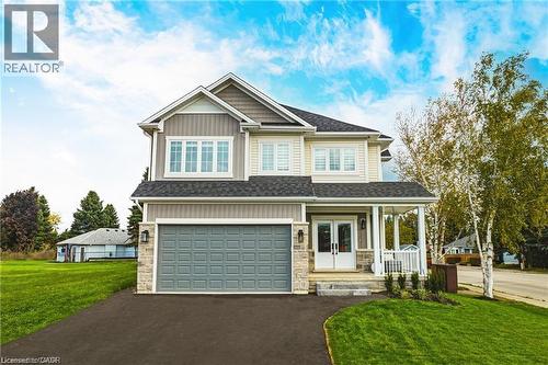 This property features a two-story exterior with light-colored siding, a dark roof, and an attached two-car garage - Lot 9 Kellogg Avenue, Hamilton, ON - Outdoor With Facade