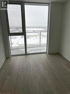Light-toned flooring and floor-to-ceiling windows offering extensive views - 