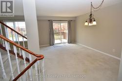 LIVING & DINING ROOM WITH WALK OUT TO DECK - 