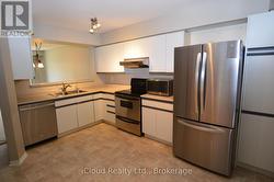 KITCHEN WITH PASS THROUGH TO DINING ROOM - 