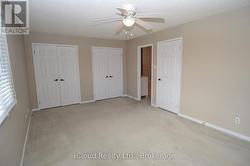 PRIMARY BEDROOM WITH ENTRANCE TO BATHROOM - 