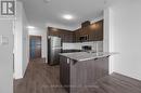Entrance and kitchen with bar - 412 - 3265 Carding Mill Trail, Oakville, ON  - Indoor Photo Showing Kitchen 