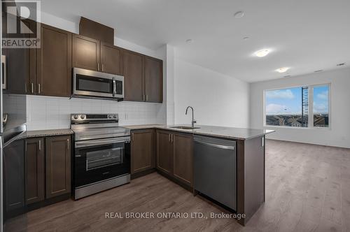 Kitchen with stainless steel appliances - 412 - 3265 Carding Mill Trail, Oakville, ON - Indoor Photo Showing Kitchen