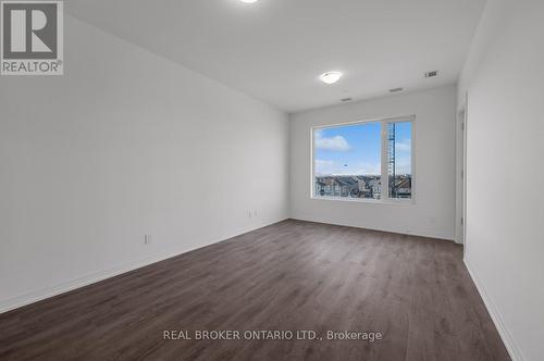 Large bedroom with oversized window - 412 - 3265 Carding Mill Trail, Oakville, ON - Indoor Photo Showing Other Room