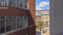 The property features brick exterior construction with large windows - 