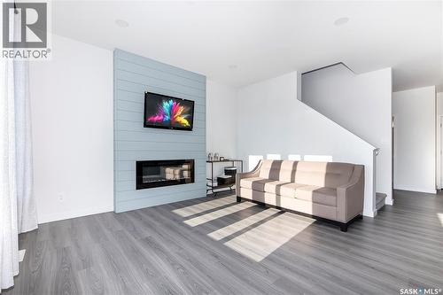 1038 Childers Court, Saskatoon, SK - Indoor Photo Showing Living Room With Fireplace