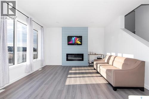 1038 Childers Court, Saskatoon, SK - Indoor Photo Showing Living Room With Fireplace
