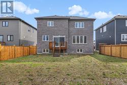 Exterior back with deck and is fully fenced - 