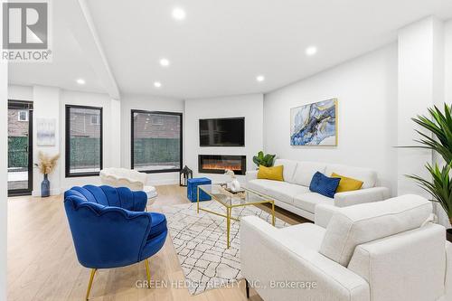 33 Dagwell Crescent, Ajax, ON - Indoor Photo Showing Living Room With Fireplace