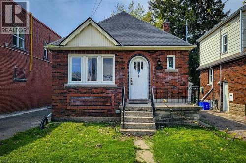 Brick bungalow featuring a steeply pitched roof and a front gable - 66 Cline Avenue Unit# Main Floor, Hamilton, ON - Outdoor With Exterior