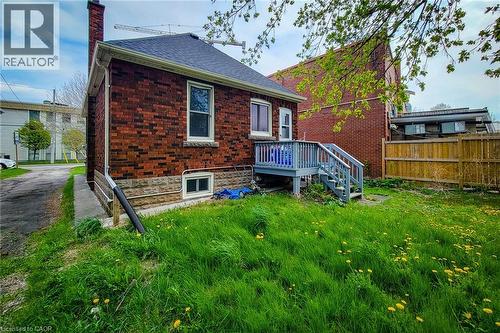 Red brick exterior with stone accent detailing - 66 Cline Avenue Unit# Main Floor, Hamilton, ON - Outdoor