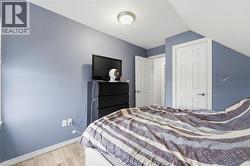 This room features light-toned flooring, a light blue wall color, and white trim - 