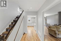 The property features hardwood flooring throughout the main level - 