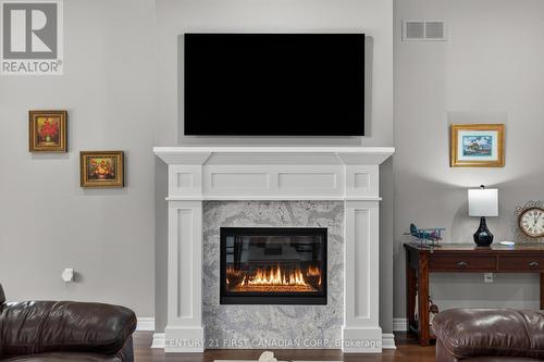 1307 Sandy Somerville Drive, London South (South A), ON - Indoor Photo Showing Living Room With Fireplace