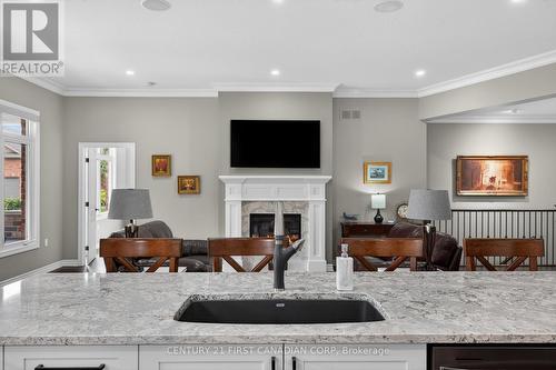 1307 Sandy Somerville Drive, London South (South A), ON - Indoor Photo Showing Kitchen With Fireplace With Double Sink With Upgraded Kitchen