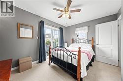 This room features a ceiling fan with light, a window with curtains, and a glass sliding door - 