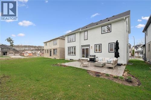 Expansive rear yard featuring a large concrete patio - 213 Fallowfield Drive, Kitchener, ON - Outdoor