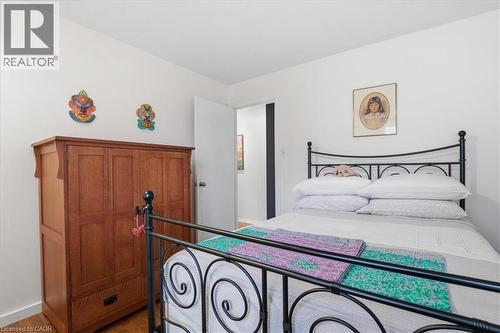 This room features hardwood floors and white walls, offering a versatile canvas for personalization - 110 Milton Avenue, Cambridge, ON - Indoor Photo Showing Bedroom