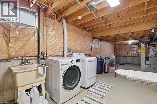 Dedicated laundry area with a utility sink and laundry appliances - 110 Milton Avenue, Cambridge, ON - Indoor Photo Showing Laundry Room