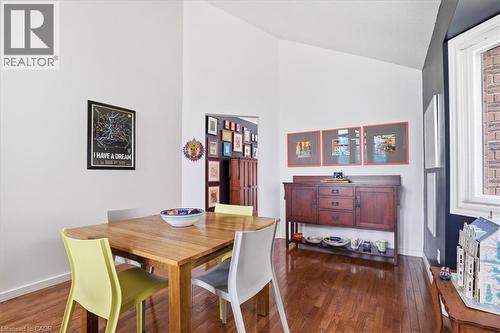 This room features hardwood floors and vaulted ceilings, creating an open and inviting atmosphere - 110 Milton Avenue, Cambridge, ON - Indoor Photo Showing Dining Room