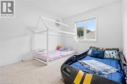 Room featuring light-colored carpet flooring and white painted walls - 