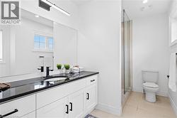 Double vanity with black countertop and undermount sinks - 